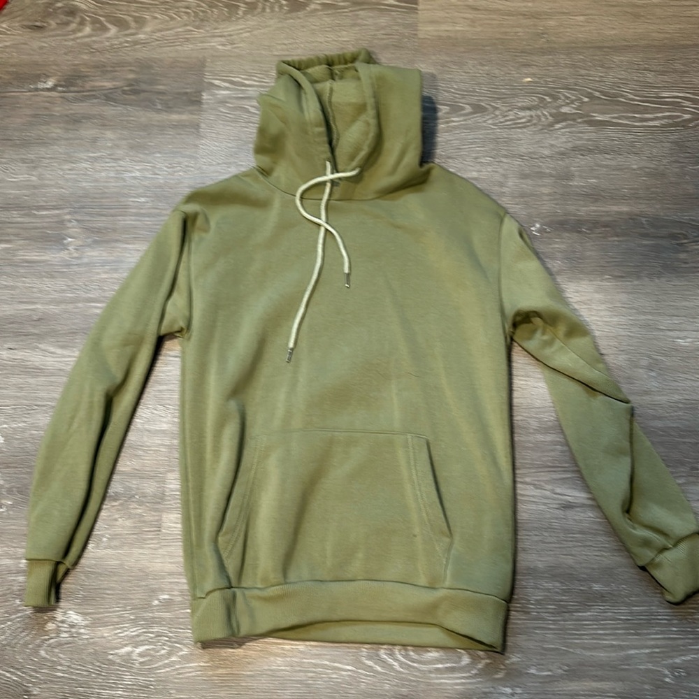 Light green sweatshirt.